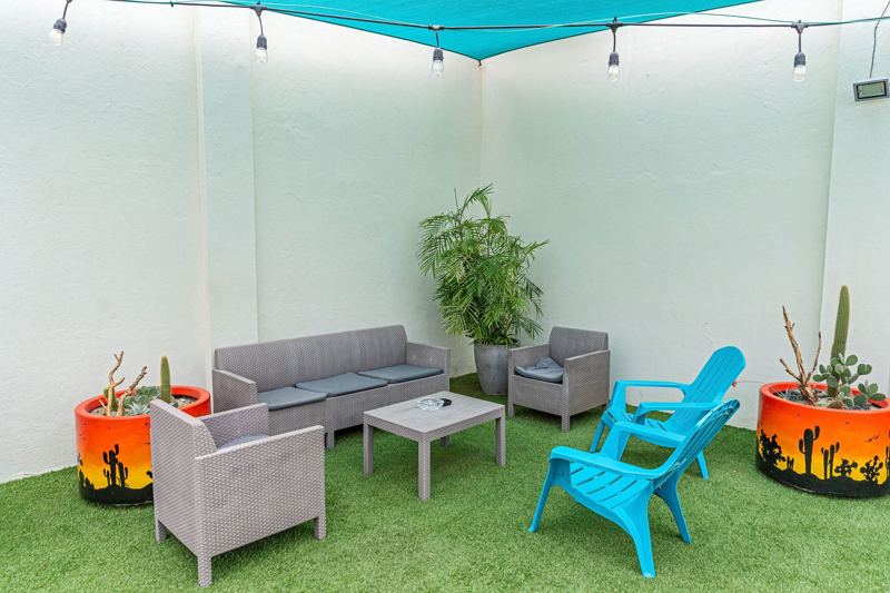 Covered lounge with grill